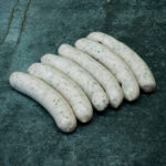 Mini Rostbratwurst aus deutschem Schweinefleisch auf Grillrost